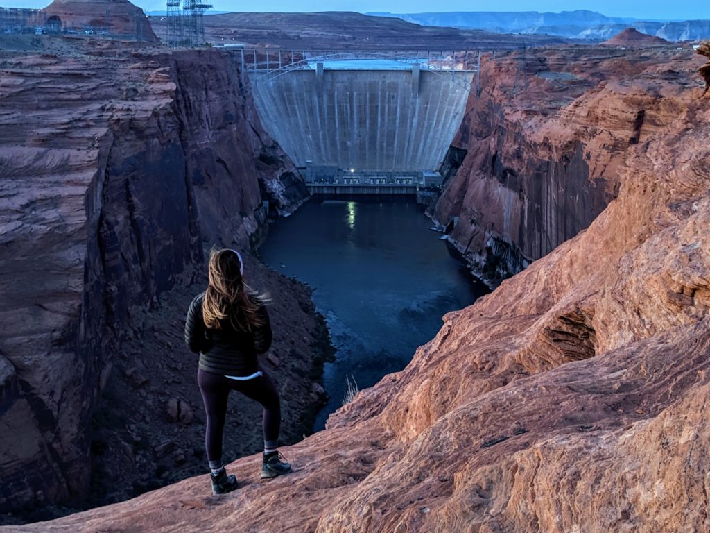 girl standing at dam overlook