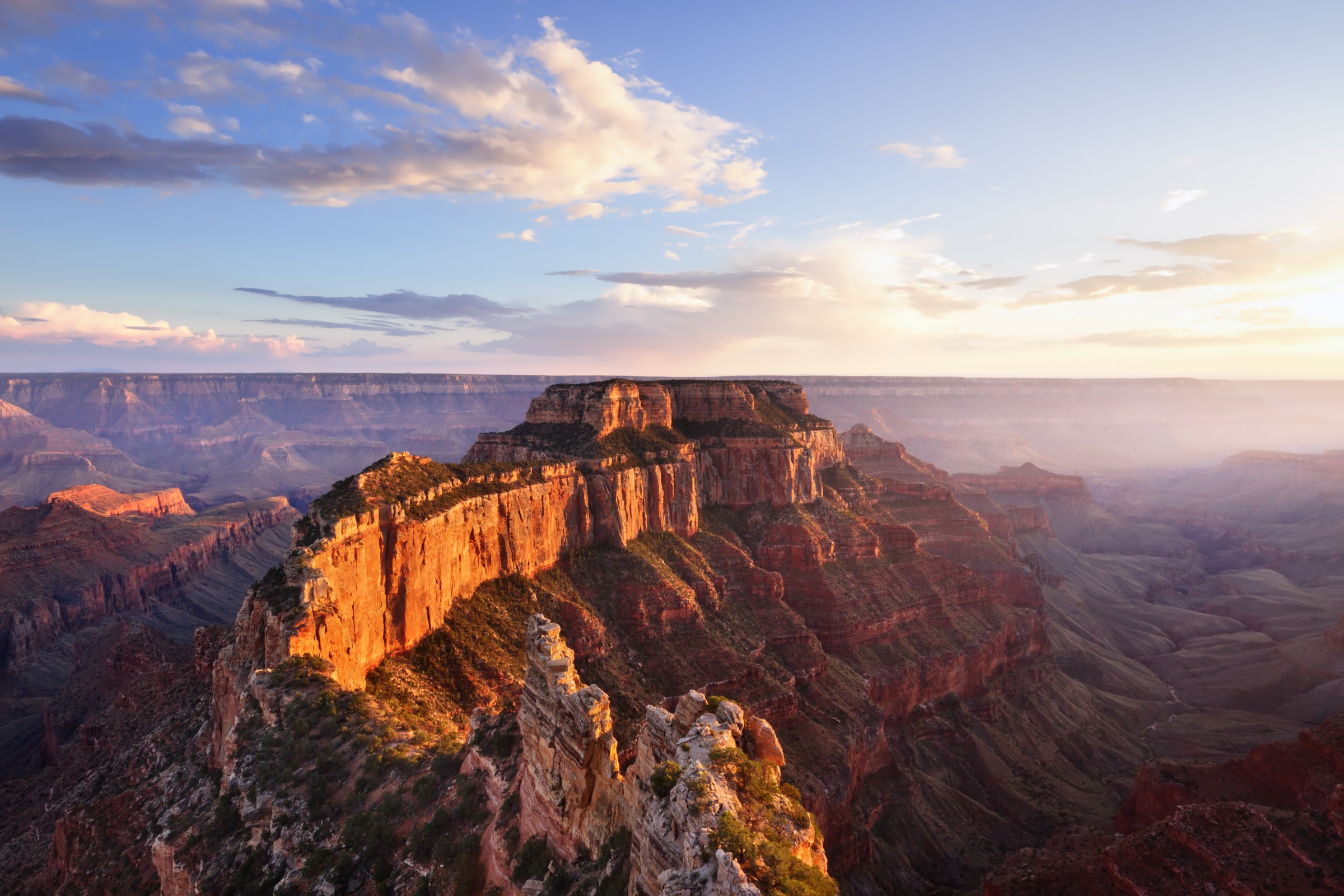 a canyon with a mountain in the background